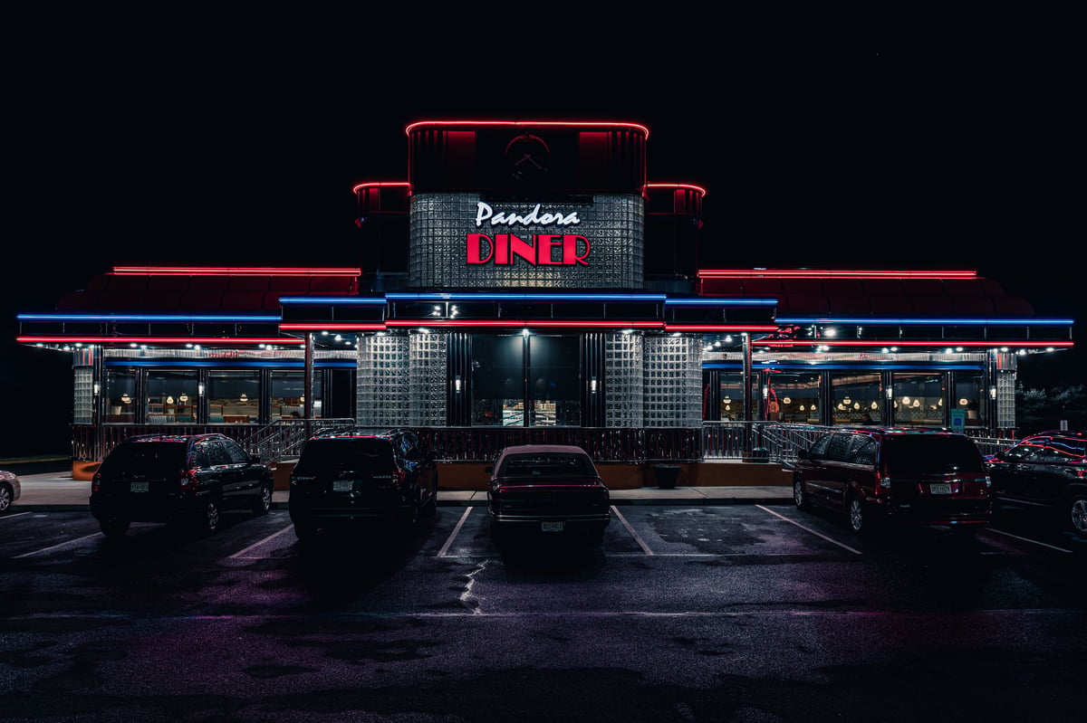 Philadelphia, United States – April 22, 2025: A stunning shot of the night view of a diner in Philadelphia lit by streetlights